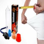 Handsome Up male enhancement vacuum pump set displayed with different sized silicone sleeves, a hand pump, and measuring tape being used by a man wearing white shorts to illustrate size measurement for male enlargement use
